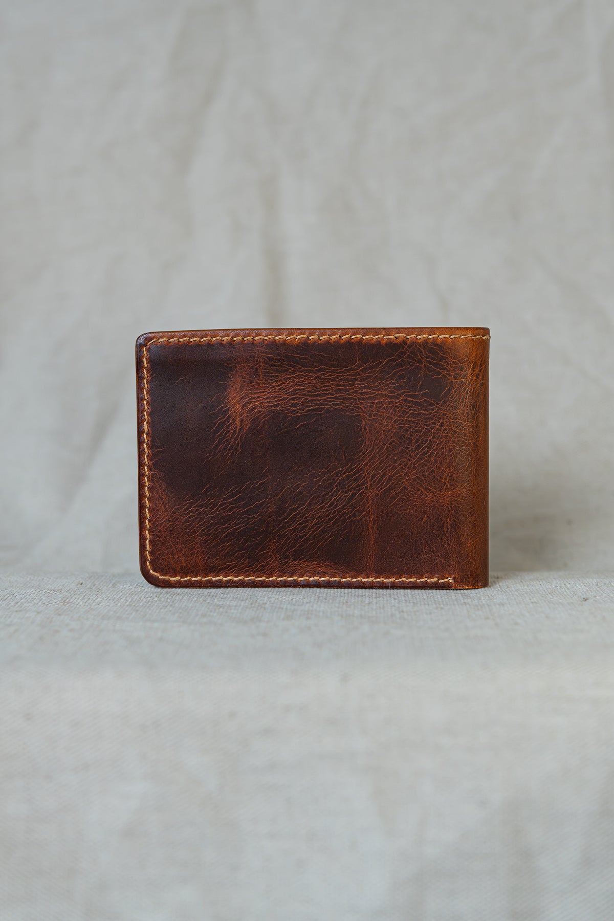 Portefeuille Tourmalet en cuir cognac, vue de dos