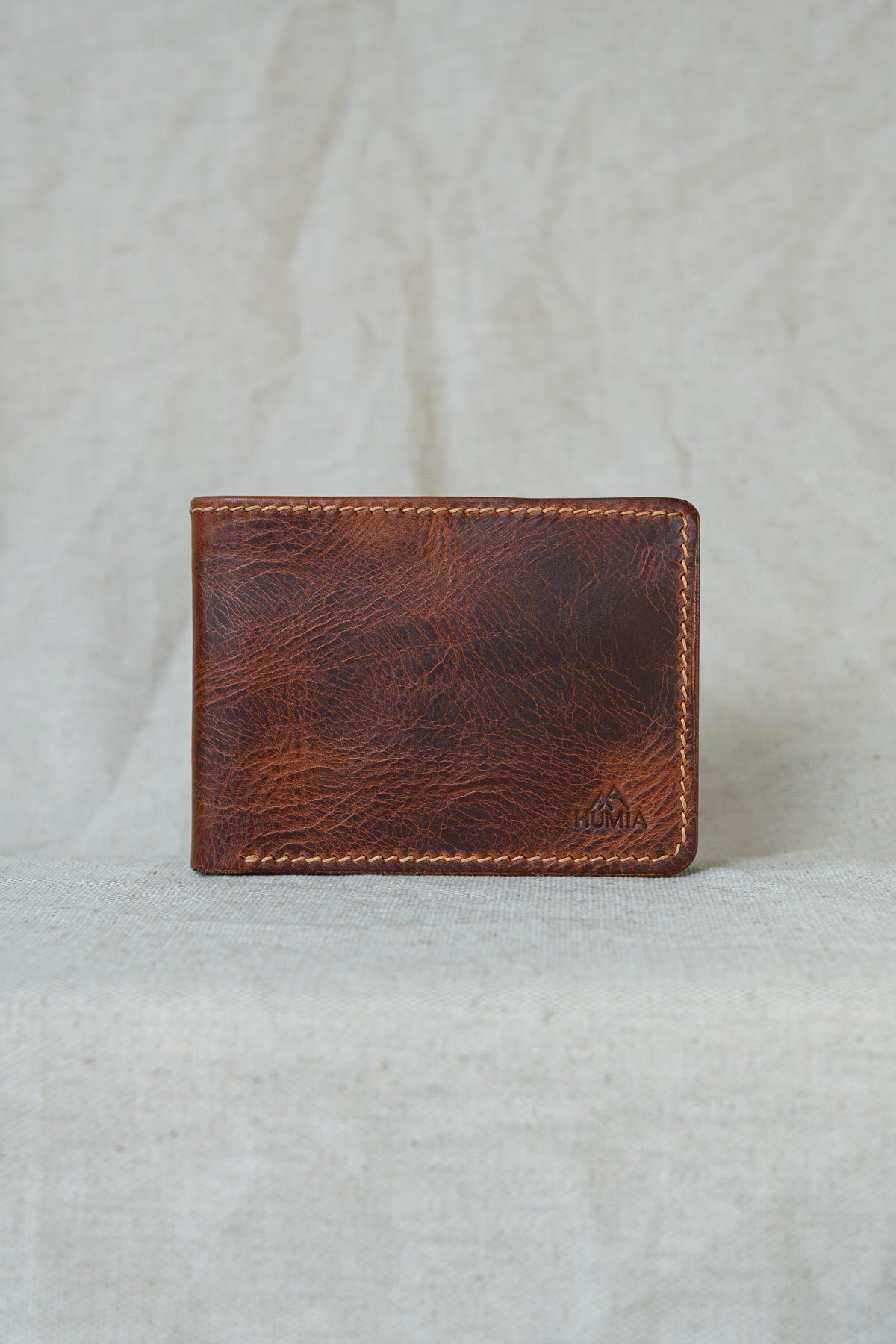 Portefeuille Tourmalet en cuir cognac et turquoise, vue de face